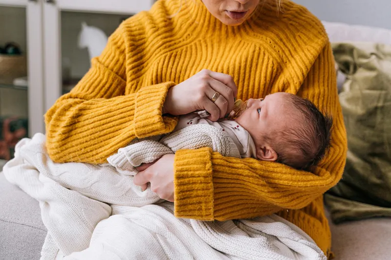 A mother feeding her newborn