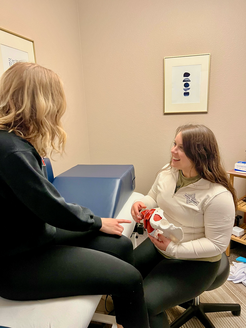 A pelvic floor therapist working with a client